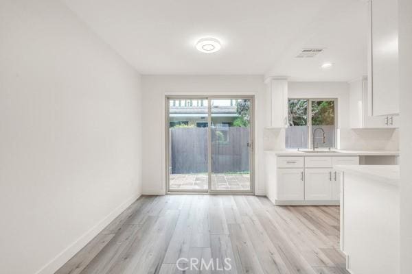 914 Fairview Ave Unit 15, Arcadia, CA 91007 - unfurnished dining area with light wood-style flooring