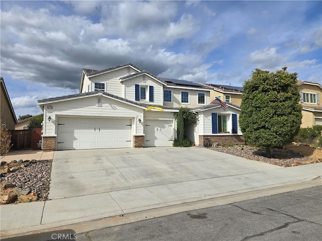 30130 Pine Needle Rd, Menifee, CA 92585 - traditional-style house with driveway, roof mounted solar panels, brick siding, and an attached garage
