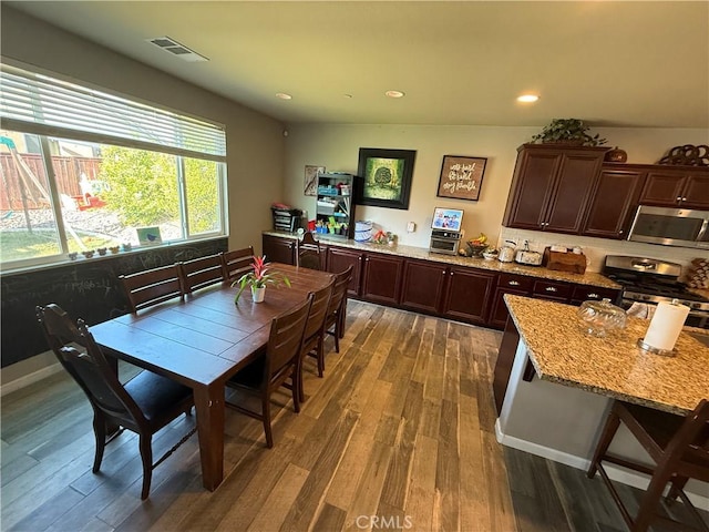30130 Pine Needle Rd, Menifee, CA 92585 - kitchen with stainless steel appliances, wood finished floors, dark brown cabinetry, light stone counters, and recessed lighting