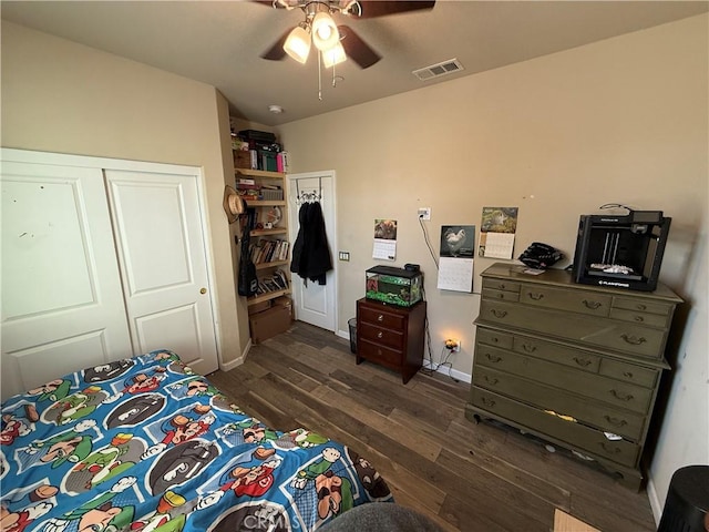 30130 Pine Needle Rd, Menifee, CA 92585 - bedroom with dark wood-style flooring, baseboards, and ceiling fan