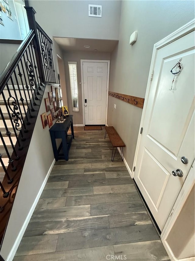 30130 Pine Needle Rd, Menifee, CA 92585 - foyer with dark wood-type flooring, baseboards, stairway, and a towering ceiling