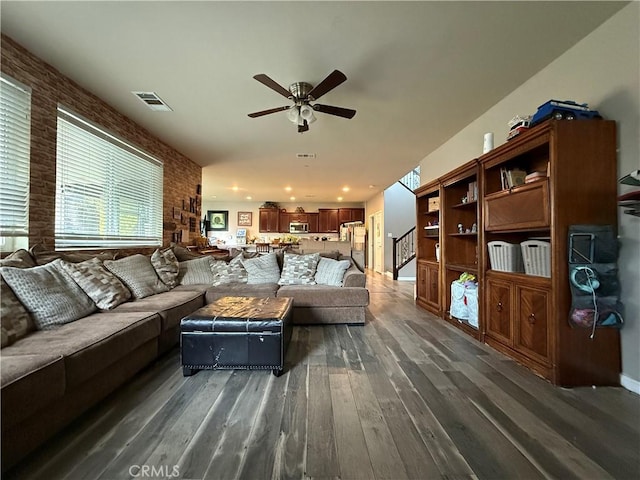 30130 Pine Needle Rd, Menifee, CA 92585 - living room with ceiling fan, dark wood-type flooring, and stairway