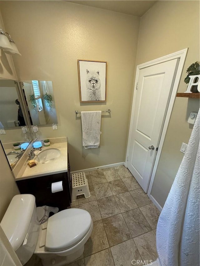 30130 Pine Needle Rd, Menifee, CA 92585 - bathroom with toilet, vanity, and baseboards
