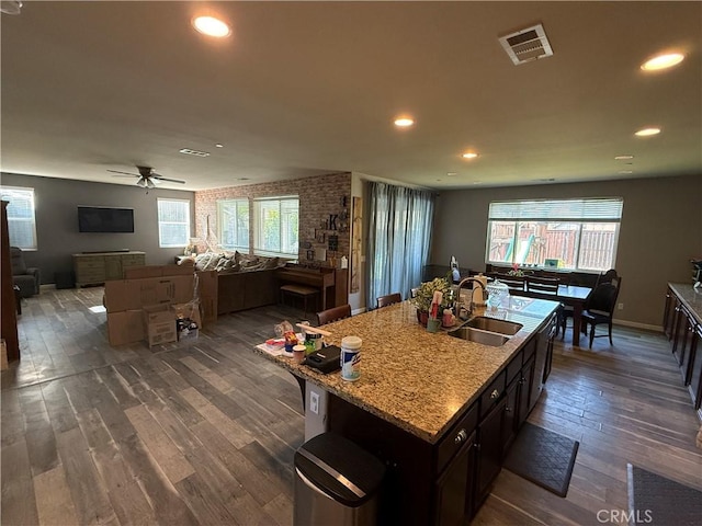 30130 Pine Needle Rd, Menifee, CA 92585 - kitchen featuring a sink, dark wood-style flooring, open floor plan, a ceiling fan, and plenty of natural light