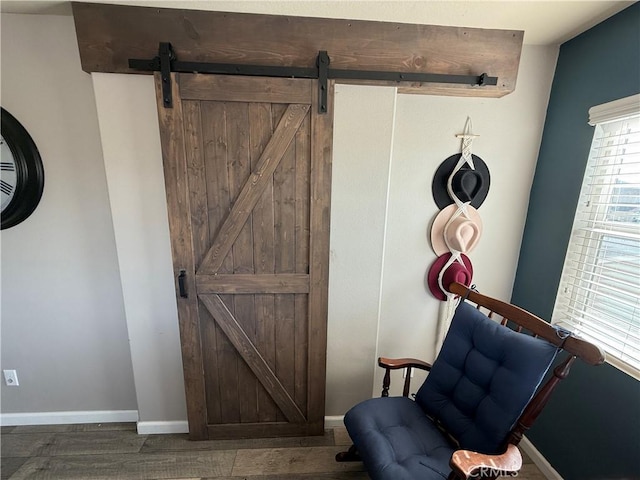 30130 Pine Needle Rd, Menifee, CA 92585 - detailed view of a barn door, wood finished floors, and baseboards