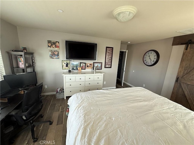 30130 Pine Needle Rd, Menifee, CA 92585 - bedroom featuring dark wood finished floors, baseboards, a barn door, and an office area