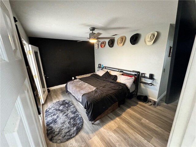 40451 Rome Beauty Way, Cherry Valley, CA 92223 - bedroom featuring wood finished floors and a ceiling fan