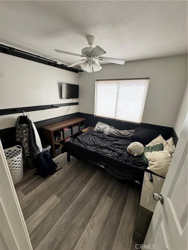 40451 Rome Beauty Way, Cherry Valley, CA 92223 - bedroom with a textured ceiling, wood finished floors, and a ceiling fan