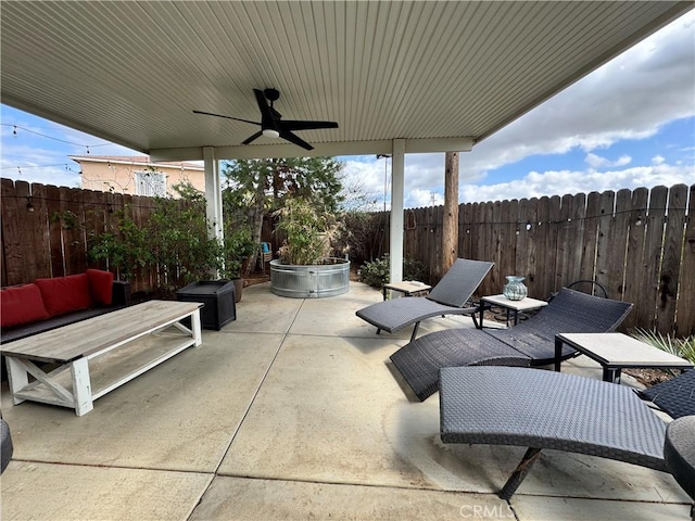 40451 Rome Beauty Way, Cherry Valley, CA 92223 - fenced backyard with a patio, a ceiling fan, and an outdoor living space