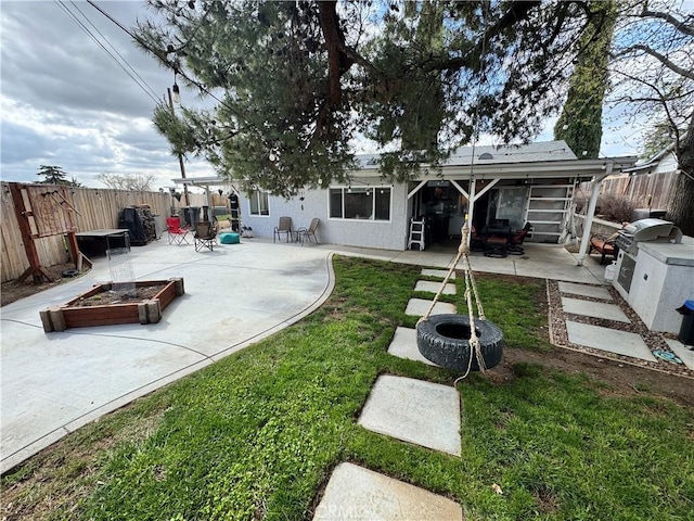40451 Rome Beauty Way, Cherry Valley, CA 92223 - rear view of property with a patio area, an outdoor fire pit, and stucco siding