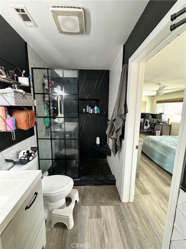 40451 Rome Beauty Way, Cherry Valley, CA 92223 - full bath with ensuite bath, wood finished floors, a walk in shower, and vanity