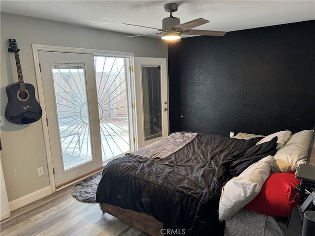 40451 Rome Beauty Way, Cherry Valley, CA 92223 - bedroom with wood finished floors, access to exterior, a ceiling fan, and baseboards