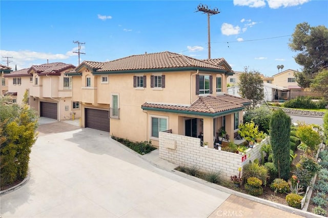 5402 Peck Rd, El Monte, CA 91732 - view of front of house featuring a tile roof, concrete driveway, stucco siding, and a garage