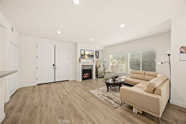 5402 Peck Rd, El Monte, CA 91732 - living room with light wood finished floors, recessed lighting, and a warm lit fireplace