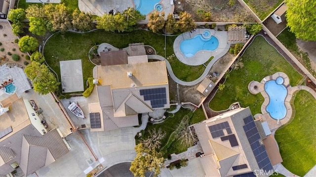 aerial view of property's location with a pool area