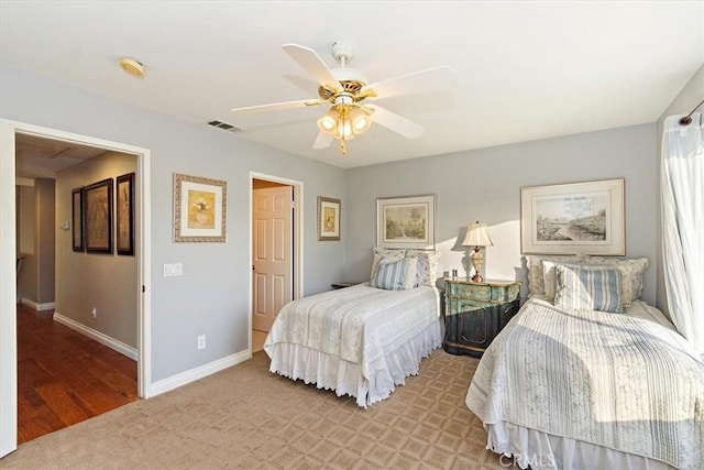 bedroom with baseboards and a ceiling fan