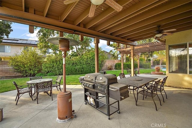 view of patio / terrace with outdoor dining space, ceiling fan, and a pergola