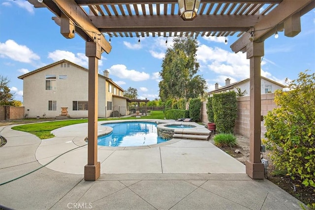 view of pool featuring a fenced backyard, a pool with connected hot tub, a pergola, and a patio area