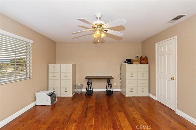 bedroom featuring wood finished floors, baseboards, and ceiling fan