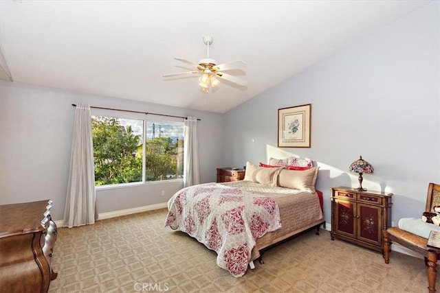 bedroom with lofted ceiling, baseboards, ceiling fan, and light colored carpet