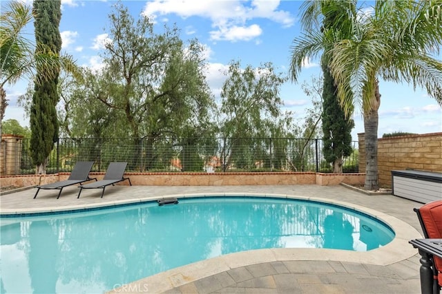 view of pool featuring a fenced in pool, a patio, and a fenced backyard