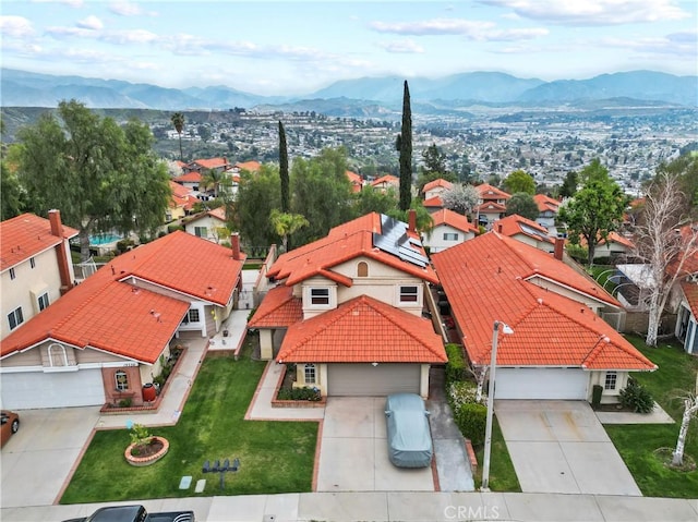 birds eye view of property with a residential view and a mountain view