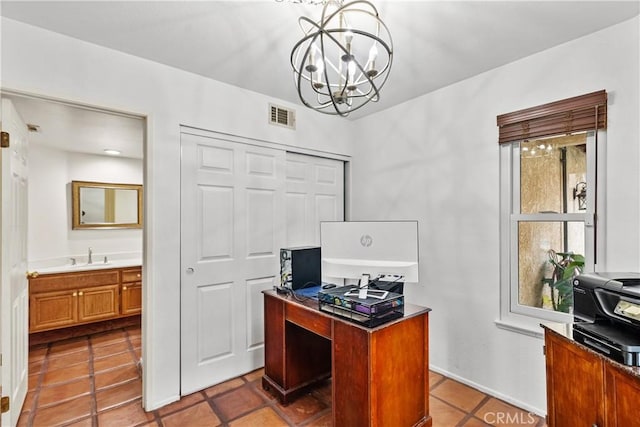 office space featuring a sink, an inviting chandelier, baseboards, tile patterned flooring, and visible vents