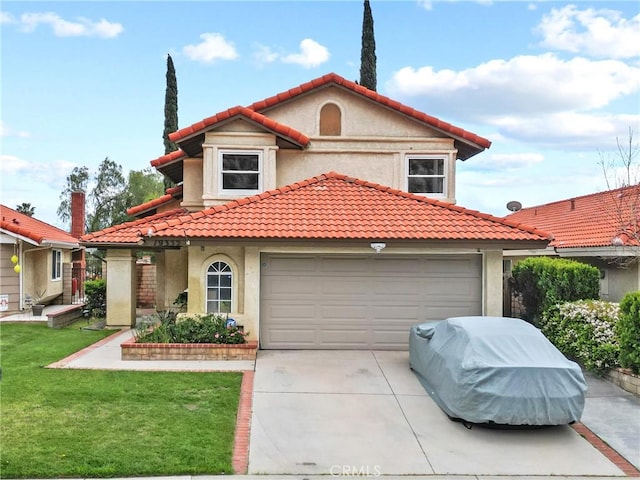 mediterranean / spanish home with stucco siding, an attached garage, a tiled roof, and concrete driveway