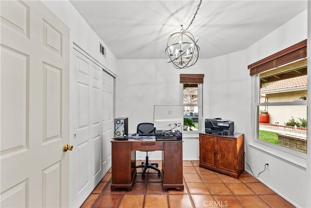 office area featuring light tile patterned flooring, a chandelier, and visible vents