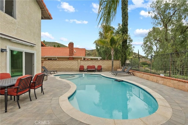 view of pool with a fenced backyard, a fenced in pool, and a patio