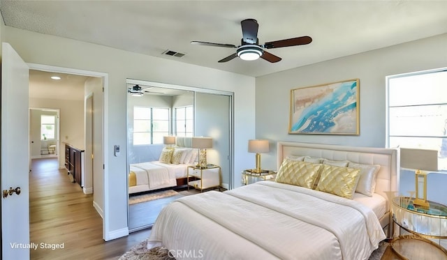 45299 Esmerado Ct, Temecula, CA 92592 - bedroom with a closet, wood finished floors, baseboards, and a ceiling fan