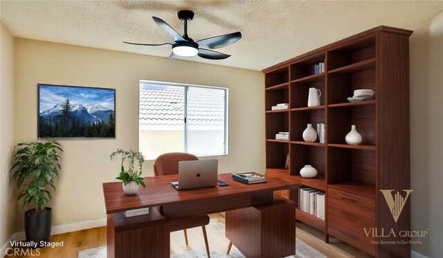 45299 Esmerado Ct, Temecula, CA 92592 - home office featuring ceiling fan, light wood finished floors, baseboards, and a textured ceiling