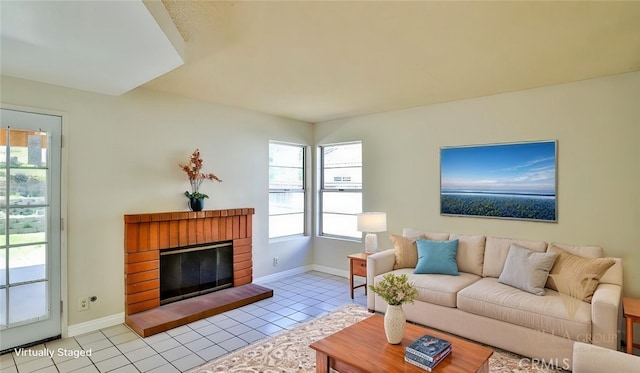 45299 Esmerado Ct, Temecula, CA 92592 - living area featuring light tile patterned floors, baseboards, and a brick fireplace