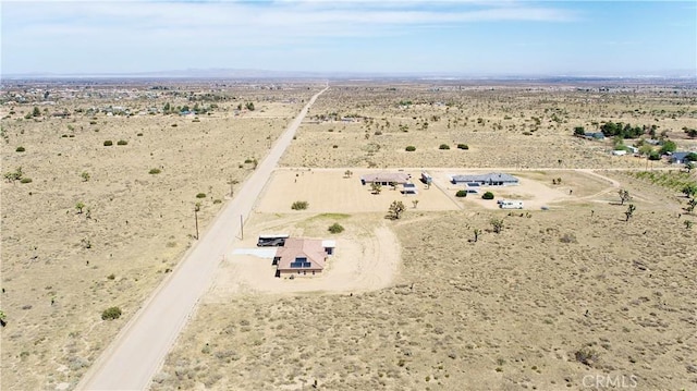 birds eye view of property featuring a rural view and view of desert