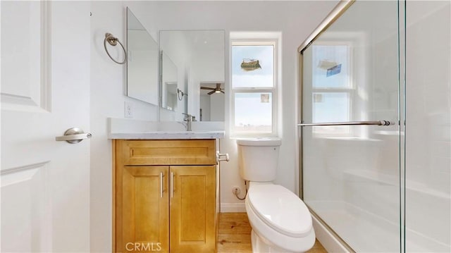 full bathroom featuring an enclosed shower and toilet