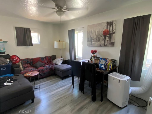 5101 Lindsey Ave, Pico Rivera, CA 90660 - living area featuring healthy amount of natural light, wood finished floors, and a ceiling fan
