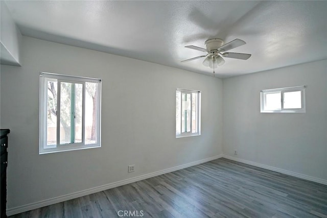 5101 Lindsey Ave, Pico Rivera, CA 90660 - spare room featuring a ceiling fan, wood finished floors, and baseboards