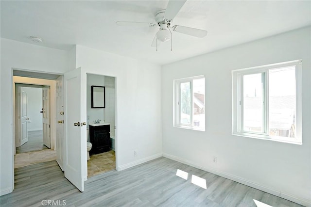 5101 Lindsey Ave, Pico Rivera, CA 90660 - unfurnished bedroom with light wood-type flooring, baseboards, and ceiling fan