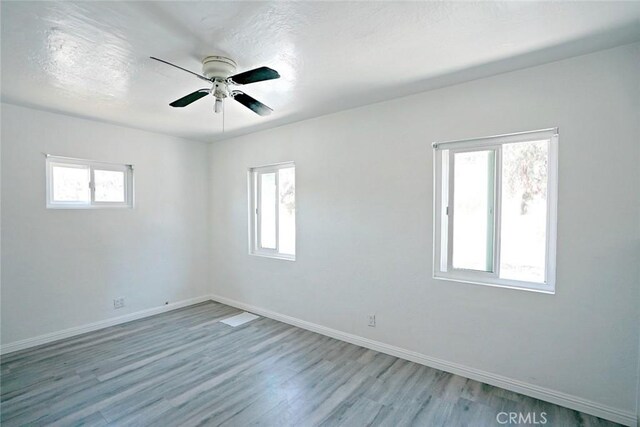 5101 Lindsey Ave, Pico Rivera, CA 90660 - unfurnished room featuring wood finished floors, a ceiling fan, and baseboards