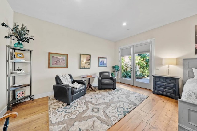 sitting room with recessed lighting, light wood-style flooring, and baseboards