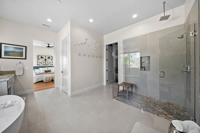 ensuite bathroom featuring a shower stall, a ceiling fan, visible vents, baseboards, and ensuite bathroom