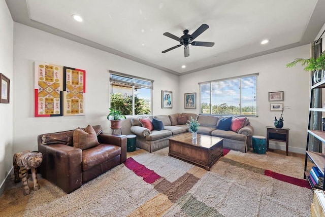 living area with a ceiling fan, recessed lighting, and baseboards