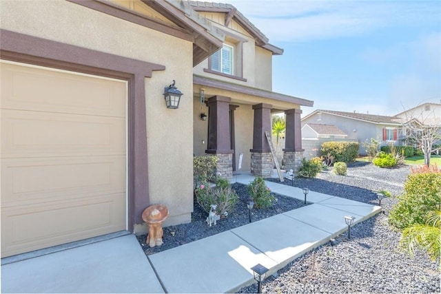 14917 Landerwood Dr, Eastvale, CA 92880 - property entrance featuring stucco siding, covered porch, and an attached garage