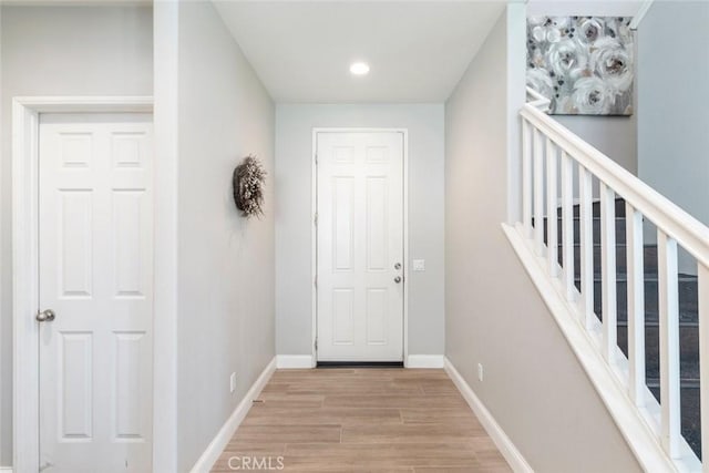 14917 Landerwood Dr, Eastvale, CA 92880 - entrance foyer featuring light wood-style flooring, baseboards, and recessed lighting