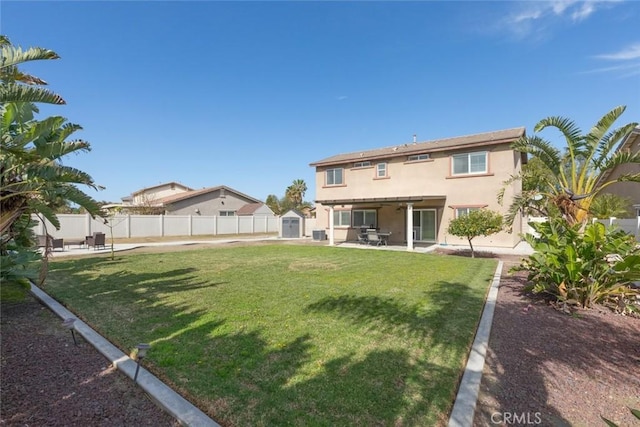 14917 Landerwood Dr, Eastvale, CA 92880 - back of house featuring a storage shed, a patio area, stucco siding, and an outdoor structure