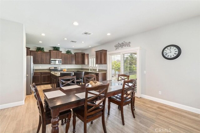 14917 Landerwood Dr, Eastvale, CA 92880 - dining space with light wood-style floors, baseboards, and recessed lighting