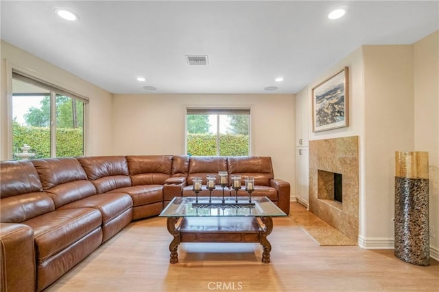 18750 Keswick St, Reseda, CA 91335 - living room with light wood-style floors, a fireplace, and recessed lighting