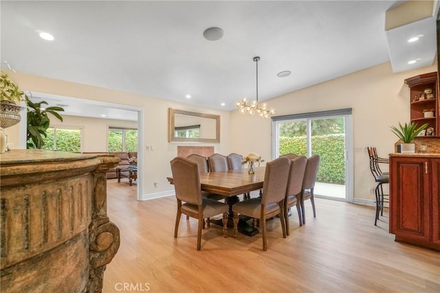 dining area with light wood finished floors, baseboards, and plenty of natural light