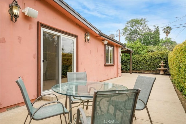 view of patio with outdoor dining area