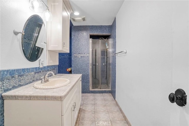 18750 Keswick St, Reseda, CA 91335 - bathroom with vanity, tile patterned floors, a stall shower, and tasteful backsplash